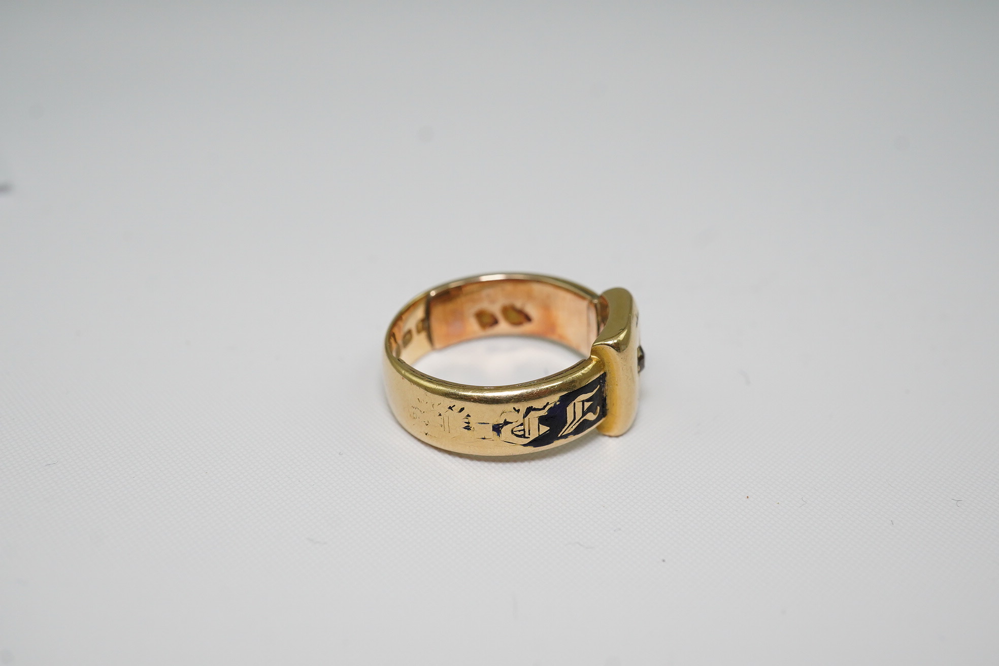 A 19th century 18ct gold, black enamel and single stone diamond set mourning ring